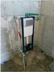 Concealed toilet cistern and wall-hung WC frame plumbing installation.