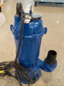 Heavy-duty blue submersible water pump repair and installation.