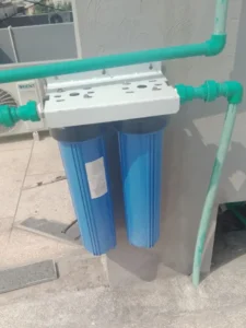 Wall-mounted RO and water filter system professional installation in Islamabad.