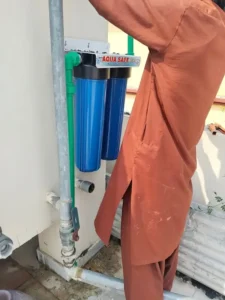 Multi-stage water filter system setup and cartridge installation near Giga Mall Islamabad.