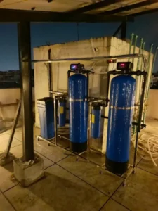 Commercial water filtration plant and tank setup by AM Plumbers in Islamabad.